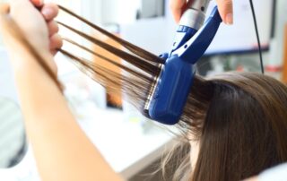 Hairdresser hairstyle models using the straightener