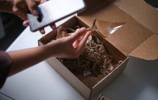 woman photographs a broken product for a support service. customer opens