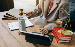 Real Estate Lawyer And House Foreclosure Law. House model, hammer judge gavel on table