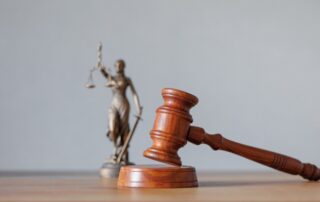 soft selective focus, the symbol of justice and justice is a statuette of the goddess Themis judge's