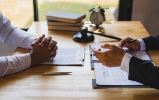 The business lawyer working about legal legislation in courtroom to help their customer, the Lawyer