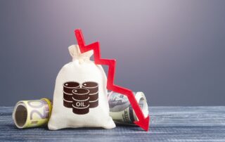 Bag of oil barrels and a red down arrow. The decline in world oil prices