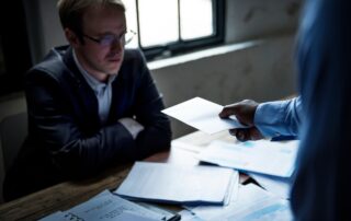 Businessman being served a lawsuit