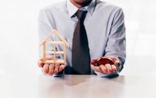 businessman in dilemma of planning to choose between spending either house or car first