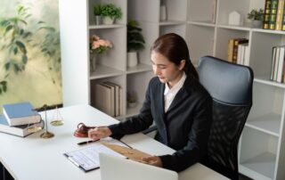 Dedicated Lawyer Reviewing Case Materials in Office
