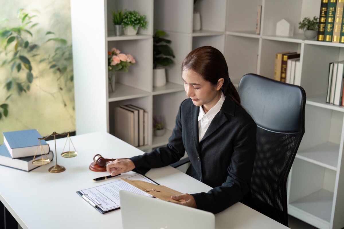 Dedicated Lawyer Reviewing Case Materials in Office