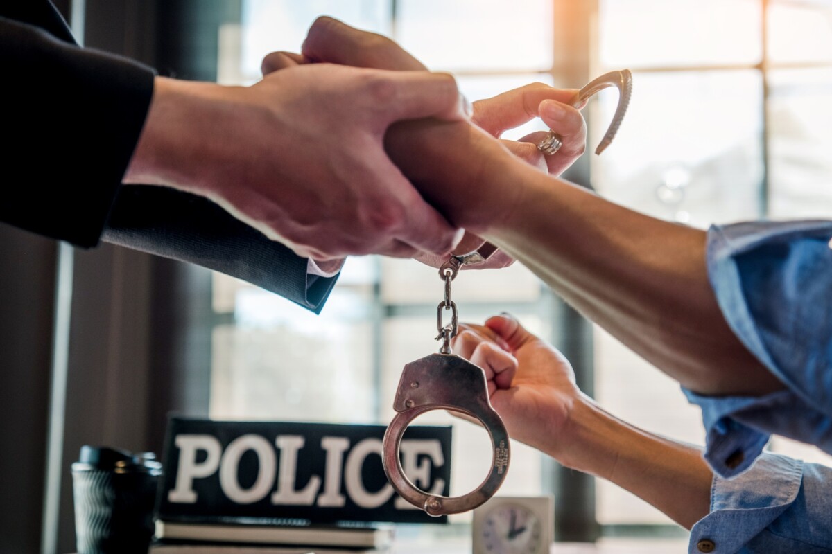 Law enforcement officer interrogating Criminals male