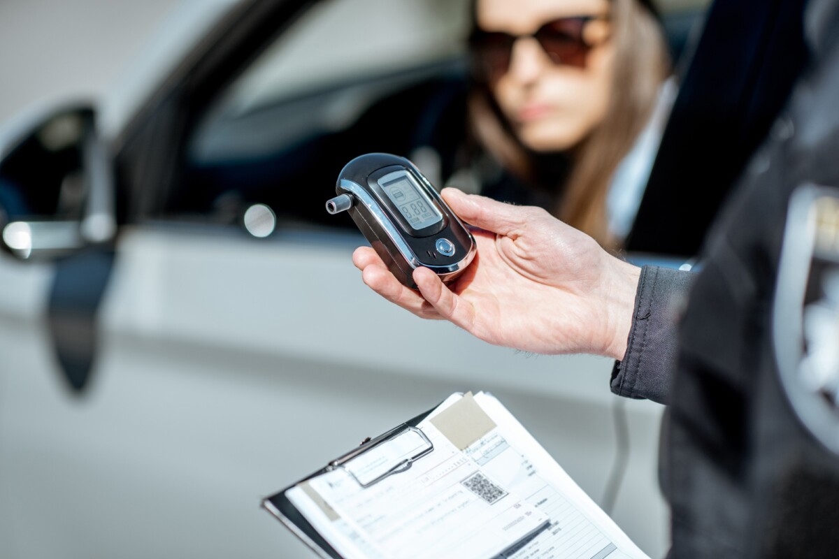 Policeman with alcotest device