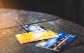 Several credit cards on wooden table