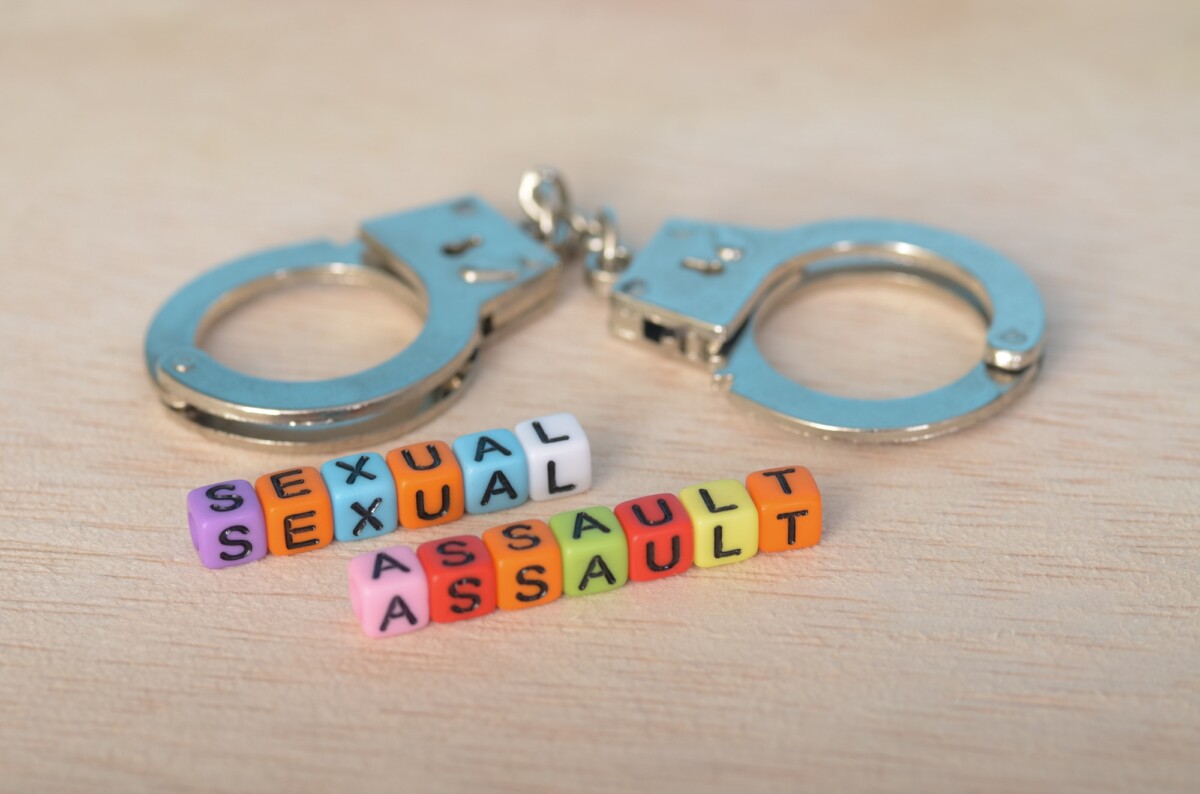Sexual Assault Awareness Justice and Accountability Represented by Handcuffs and Beads Sexual Assault Awareness: Justice and Accountability Represented by Handcuffs and Beads