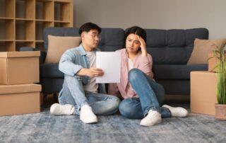 Unhappy Asian Family Couple Having Issue With Mortgage Debt Indoor