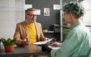 Woman with disability signing documents